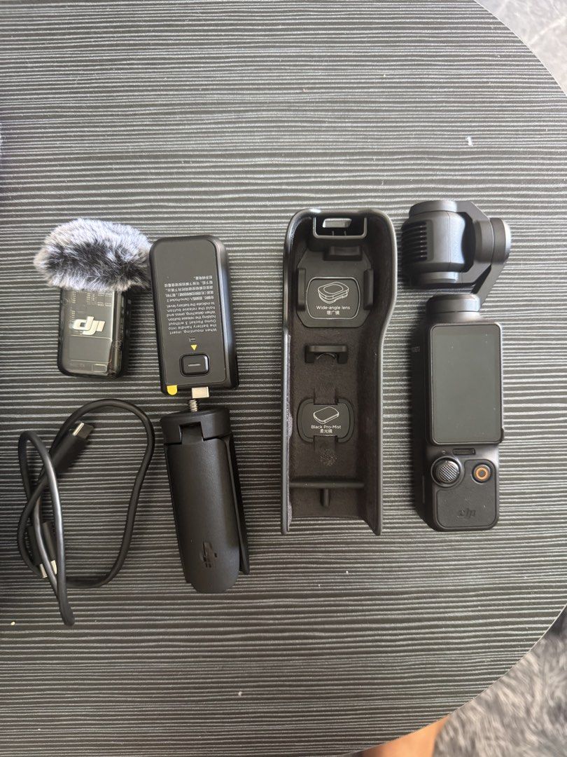 DJI Osmo Pocket 3 Creator Combo Camera Kit (Category: Cameras) located in Pasig City. Submitted by acombalecer (Listing ID 1468967976, Image 3). Description: - Complete DJI Osmo Pocket 3 Creator Combo set - Fully tested and 100% working condition - Includes camera with rotating touchscreen and battery handle - Comes with DJI Mic 2 transmitter and deadcat wind muff - Includes mini tripod, protective cover, and USB-C cable - Everything packs away n