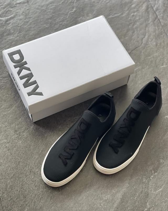 DKNY Black Slip-On Sneakers with Box (Category: Sneakers) located in Caloocan City. Submitted by Roowchelly (Listing ID 1469125052, Image 1). Description: - Brand: DKNY - Color: Black with white sole - Style: Slip-on sneakers with bold raised logo lettering on top and heel - Material: Comfortable and breathable knit fabric upper - Inclusions: Original white DKNY brand box - Condition: Excellent / Like new - Perfect for casual, on-the-go styling W