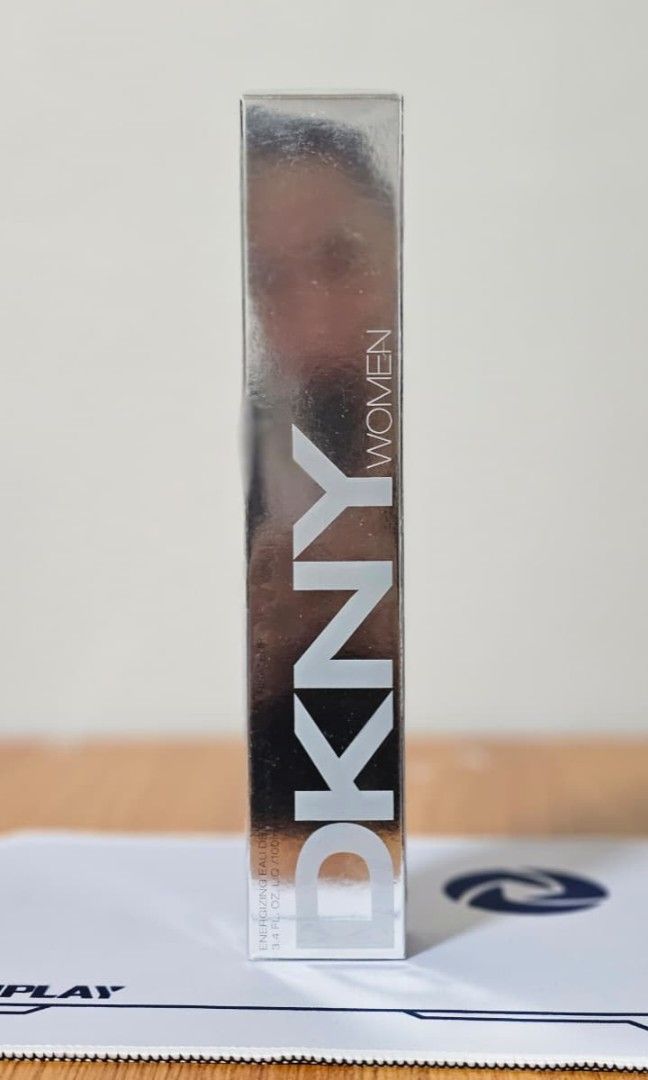 DKNY Women Energizing Eau De Parfum Spray (Category: Fragrance & Deodorants) located in Mexico. Submitted by ebili.na (Listing ID 1465021461, Image 1). Description: • 🍊 Scent profile: Crisp citrus, chilled vodka, and clean woods. • 📸 Visual: Sleek bottle against a modern, sunny city background. • 📏 Size: 100ml • 🛡️ Authenticity: 100% Original • 📅 ETA: End of December 2026.
