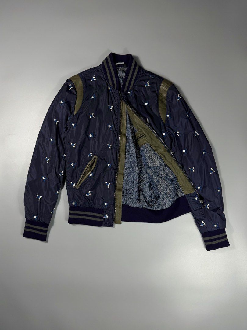Dolce & Gabbana Fleur Bomber Semi Puffer Jacket (Category: Coats, Jackets and Outerwear) located in Manila. Submitted by whowearsstreetwear (Listing ID 1469035765, Image 2). Description: Dolce & Gabbana Fleur AOP Bomber Semi Puffer Jacket Navy (Authentic) - Size: Small - Medium (measurements in inches) W - 19 L - 26 Condition: Excellent Flaw/s: none Crafted with an exquisite all-over Fleur embroidery, this Dolce & Gabbana semi-puffer jacket merge