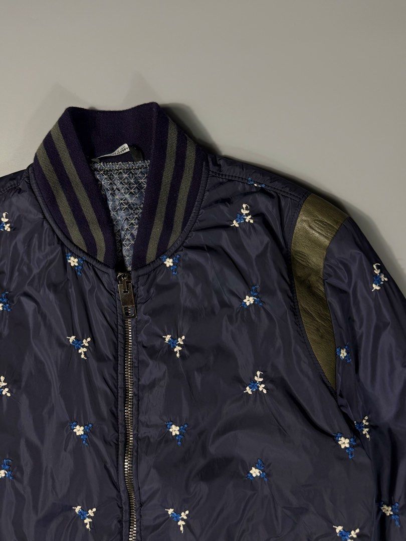Dolce & Gabbana Fleur Bomber Semi Puffer Jacket (Category: Coats, Jackets and Outerwear) located in Manila. Submitted by whowearsstreetwear (Listing ID 1469035765, Image 3). Description: Dolce & Gabbana Fleur AOP Bomber Semi Puffer Jacket Navy (Authentic) - Size: Small - Medium (measurements in inches) W - 19 L - 26 Condition: Excellent Flaw/s: none Crafted with an exquisite all-over Fleur embroidery, this Dolce & Gabbana semi-puffer jacket merge