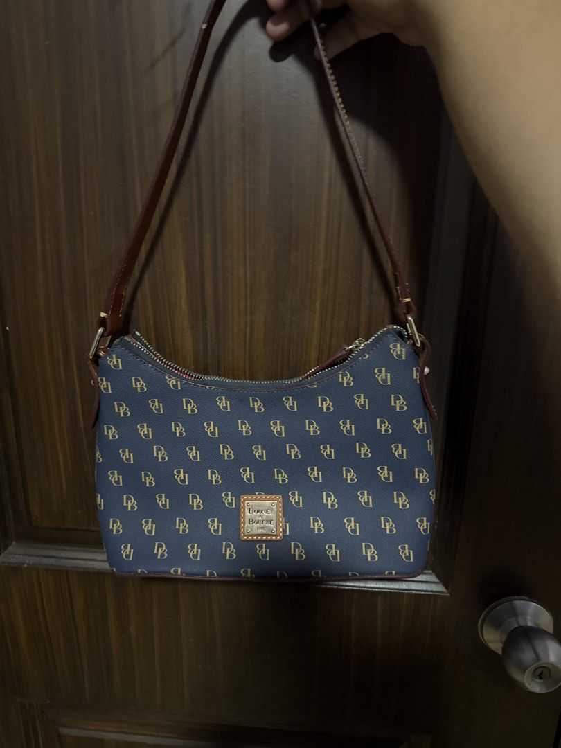 Dooney & Bourke Navy Monogram Shoulder Bag (Category: Luxury Bags & Wallets) located in Paranaque City. Submitted by yoonglescatcafe (Listing ID 1469030300, Image 1). Description: — Can send more pictures/videos only if INTERESTED BUYER — MAYA/BPI — SEE FLAWS. — MOD: SDD/J&T.