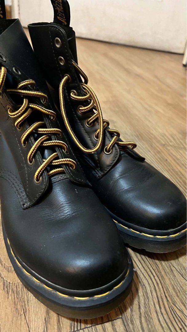 Dr. Martens 1460 Pascal Black Leather Boots (Category: Boots) located in Manila. Submitted by janicauy (Listing ID 1469114375, Image 2). Description: - Brand: Dr. Martens (Guaranteed Original) - Model: 1460 Pascal Boots - Color: Black leather - Size: UK 6 / EU 39 / US 8 - Extras: Includes unique yellow and brown patterned laces - Condition: Minor leather creasing and slight wear on bottom treads from normal use - Style: Classic air-cushioned sole