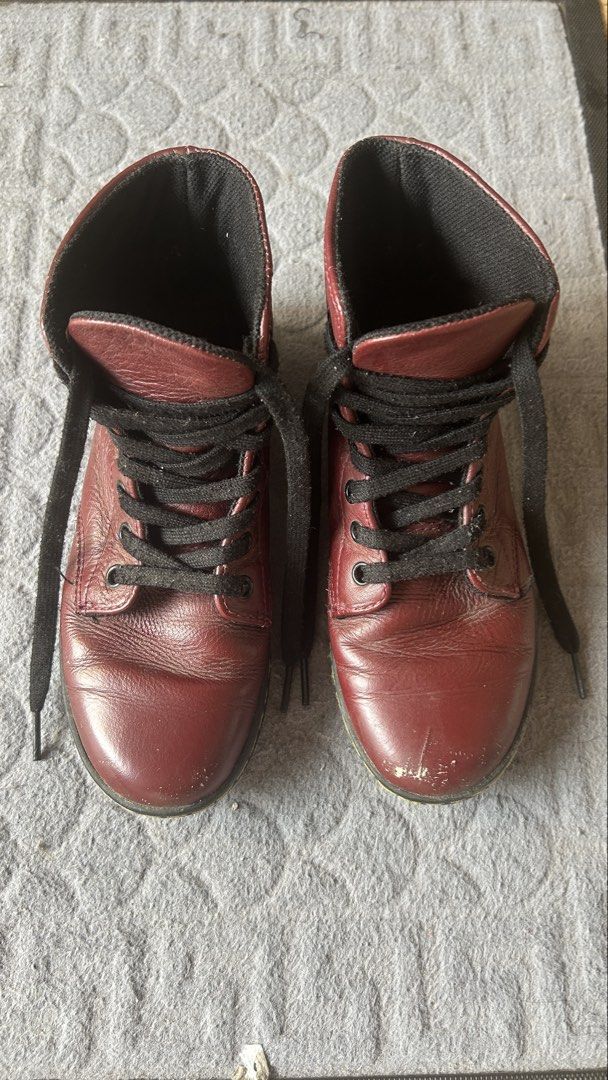 Dr. Martens Leyton Cherry Red Boots Size UK 3 (Category: Boots) located in Paranaque City. Submitted by jesseygirl83 (Listing ID 1468974200, Image 1). Description: - Brand: Dr. Martens (Leyton) - Color: Cherry Red with black laces and lining - Size: UK 3 / EU 36 / US 5 - Features: Classic AirWair heel loops, durable rubber soles with tread intact - Condition: Pre-loved with visible scuffing and scratches on both toe caps, but still has plenty of 