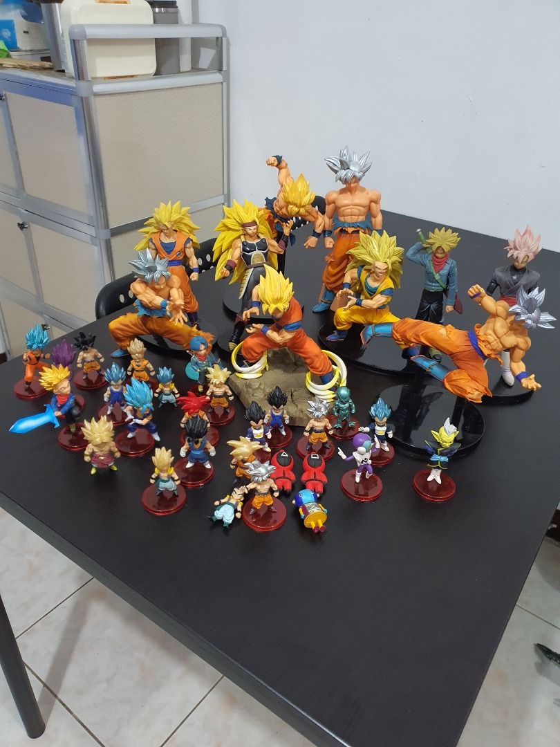Dragon Ball Z & Super Action Figures Collection. (Category: Figurines & Statues) located in Caloocan City. Submitted by cleverwind_1e53ab (Listing ID 1468974638, Image 1). Description: - Massive Dragon Ball action figure collection set - Includes Goku, Vegeta, Trunks, and multiple Super Saiyan forms - Features a mix of sizes, including large figures on black stands and cute chibi figures - Great display pieces and must-have for anime fans - Selli
