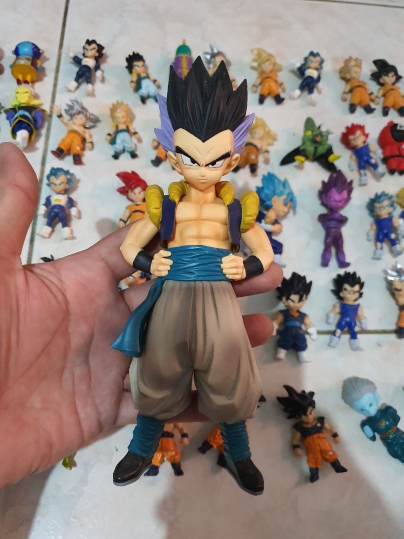 Dragon Ball Z & Super Action Figures Collection. (Category: Figurines & Statues) located in Caloocan City. Submitted by cleverwind_1e53ab (Listing ID 1468974638, Image 3). Description: - Massive Dragon Ball action figure collection set - Includes Goku, Vegeta, Trunks, and multiple Super Saiyan forms - Features a mix of sizes, including large figures on black stands and cute chibi figures - Great display pieces and must-have for anime fans - Selli