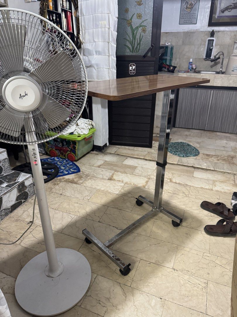Drive Medical Overbed Table with Wheels (Category: Medical Supplies & Tools) located in Quezon City. Submitted by chi__028 (Listing ID 1468985368, Image 3). Description: - Features: Height-adjustable stem and smooth-rolling casters on an H-style base - Materials: Wood-grain top and durable chrome steel base - Condition: Fully functional and sturdy - Ideal Use: Great bedside table for meals, reading, or laptop use.