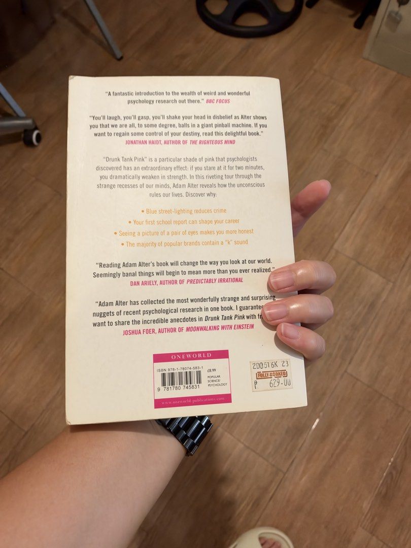 Drunk Tank Pink by Adam Alter (Category: Storybooks) located in Manila. Submitted by garagesalebykoda (Listing ID 1468986857, Image 3). Description: - Title & Author: Drunk Tank Pink by Adam Alter - Publisher: Oneworld (ISBN: 978-1-78074-583-1) - Genre: Explores how subconscious forces shape everyday thinking, feeling, and behavior - Condition: Read once, stored on a shelf; shows normal page tanning from age and slight shelf wear at the edges - F