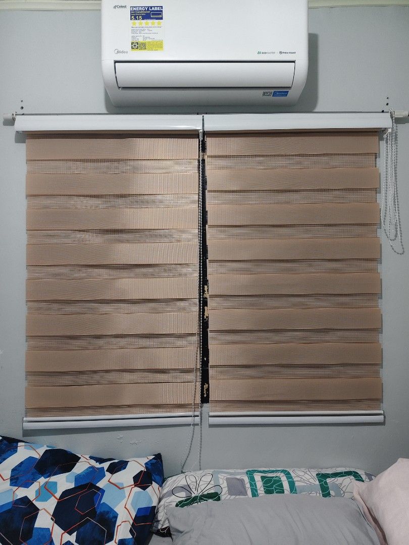 Dual layer zebra roller blinds brown roller shades window treatment (Category: Curtains & Blinds) located in Manila. Submitted by paulaceejay14 (Listing ID 1469058318, Image 3). Description: - Item: Double layer zebra roller blinds - Color: Light Brown - Design: Striped fabric for adjustable light filtering - Operation: Easy pull cord adjustment - Style: Clean, modern look perfect for bedroom or living room - Inclusion: Comes with wall brackets, 