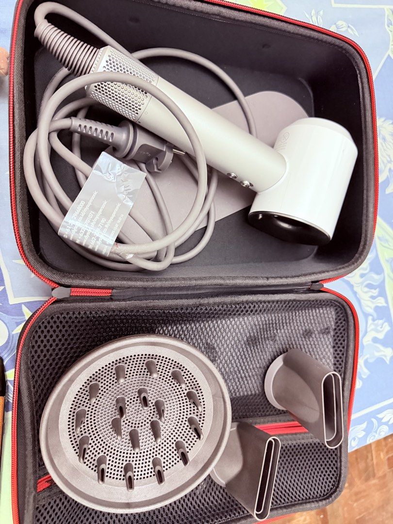 Dyson Hair Dryer HD01 (Category: Hair Accessories) located in Manila. Submitted by yangbracs (Listing ID 1469109351, Image 1). Description: Dyson Hair Dryer HD01 White/Silver No issue No box With bag and manuals Loc Paranaque.