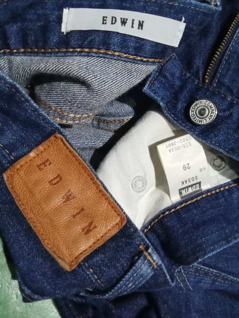 EDWIN 503AK Dark Wash Denim Jeans (Category: Jeans) located in Caloocan City. Submitted by calmcat_6fd4f7 (Listing ID 1468939813, Image 3). Description: - Brand: Edwin 503AK - Wash: Deep indigo dark wash with natural thigh fading - Fit: Classic straight leg - Details: Button fly, metal hardware, branded back leather patch - Tag Size: 29 - Actual Measurements: 32" waist, 37" length, 6.5" hem opening - Condition: Excellent pre-loved condition.