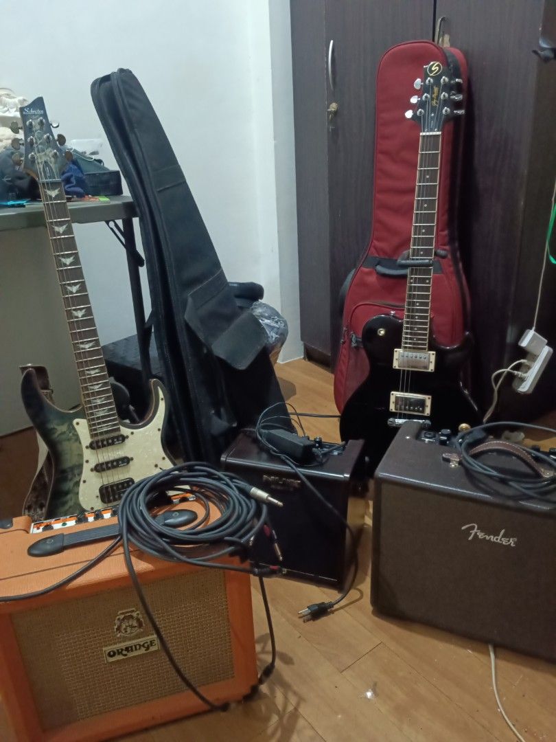 Electric Guitars Amps and Accessories Bundle (Category: Musical Instruments) located in Quezon City. Submitted by giox315 (Listing ID 1469151442, Image 1). Description: - Complete electric guitar starter/practice bundle - Includes 2 electric guitars ready to play (shecter diamond series banshee 6 and samick) - Multiple amps featuring Orange Crush 20L, Nux AC 25 and Fender Acoustic Junior - 2 Gig bags, 2 guitar stands, 2 sets of new and original e
