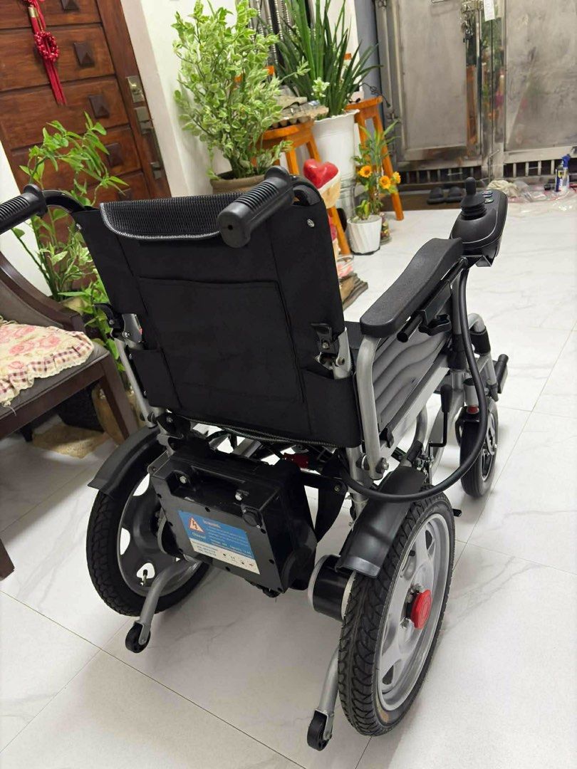 Electric Wheelchair (Category: Wheelchairs) located in San Fernando. Submitted by emii_21 (Listing ID 1468971921, Image 3). Description: - Condition: Good working condition, easy to operate - Control: Responsive joystick on the right armrest - Comfort: Padded black mesh seat and backrest - Design: Sturdy silver metal frame with foldable front footrests Location: San Fernando, Pampanga.