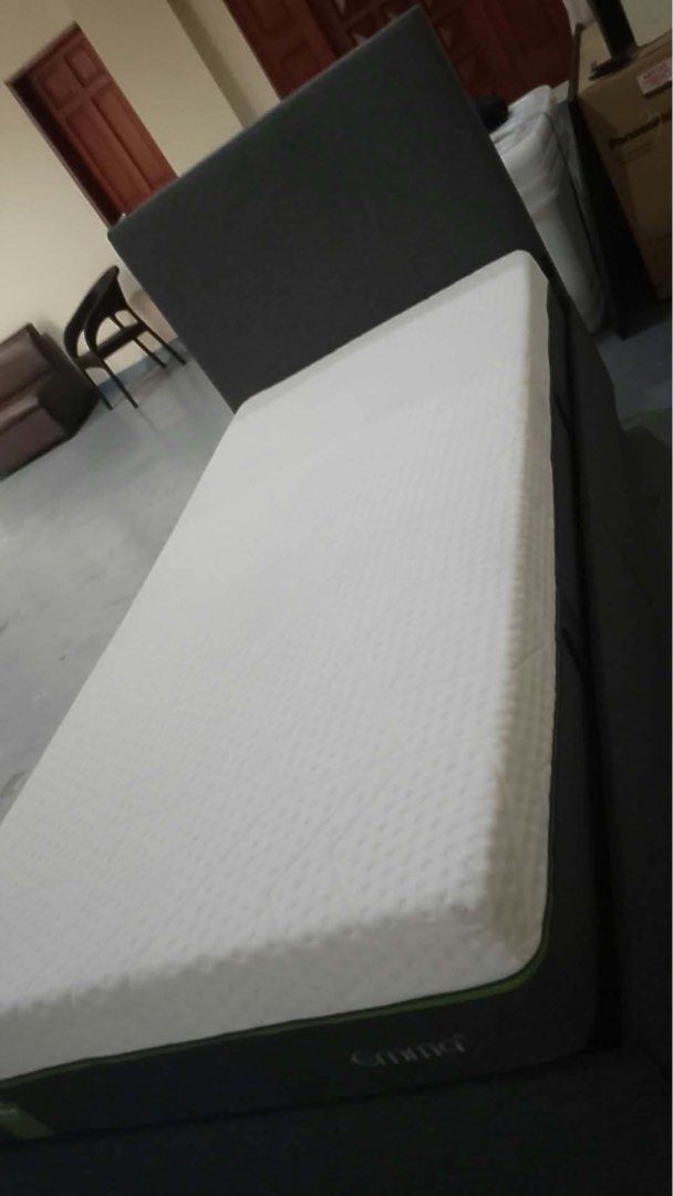 Emma Mattress with Dark Grey Bed Frame (Category: Bed Frames & Mattresses) located in Manila. Submitted by karenchua109888 (Listing ID 1468987877, Image 2). Description: - Size: Single - Mattress: Emma supportive foam with clean white quilted top cover - Bed Frame: Dark grey upholstered with a stylish tall headboard - Condition: Solid structure overall - Perfect space-saving setup for bedrooms or guest rooms - Note: Pick up only.