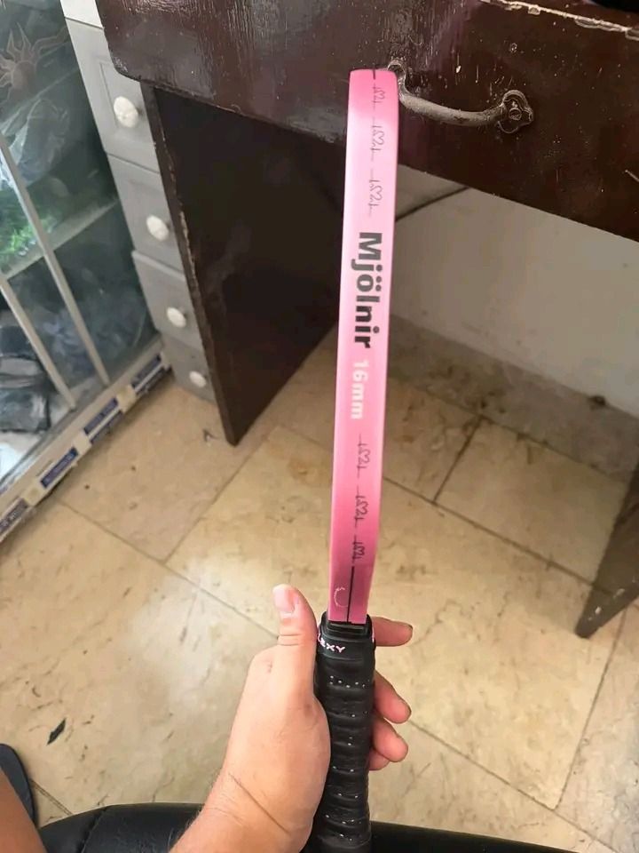Enflexy Mjolnir 16mm Pickleball Paddle Pink (Category: Racket and Ball Sports) located in Atimonan. Submitted by brightriver_ee140a (Listing ID 1469097049, Image 3). Description: - Model: Enflexy Mjolnir Pickleball Paddle - Thickness: 16mm for enhanced stability and touch - Build: Durable unibody design with a striking black textured surface and pink trim - Grip: Standard wrapped black handle for comfortable play - Performance: Offers great contr