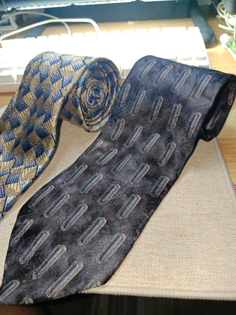 Ermenegildo Zegna Geometric Pattern Silk Tie (Category: Ties) located in Quezon City. Submitted by charlesfab66127 (Listing ID 1469086787, Image 3). Description: - Brand: Ermenegildo Zegna - Material: 100% High-quality Italian Silk - Design: Detailed geometric basketweave pattern in gold, blue, and grey tones - Features: Standard width blade, clean pointed tip, and branded fabric keeper loop - Ideal for: Formal events, weddings, and professional 
