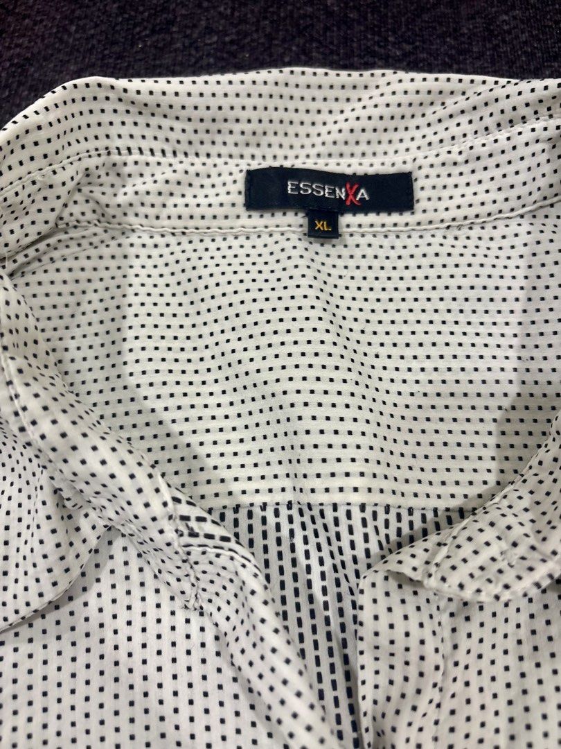 Essenx A White Black Dot Long Sleeve Button Up Blouse XL (Category: Longsleeves) located in Quezon City. Submitted by fast.closetfinds (Listing ID 1469021777, Image 3). Description: - Color & Pattern: White with black dots - Size: XL - Design: Classic collar, front button closure, and long sleeves with cuffs - Condition: Excellent / Pre-loved (ready to wear) - Style: Versatile for office work or casual outings - Shipping or meet-up options availa