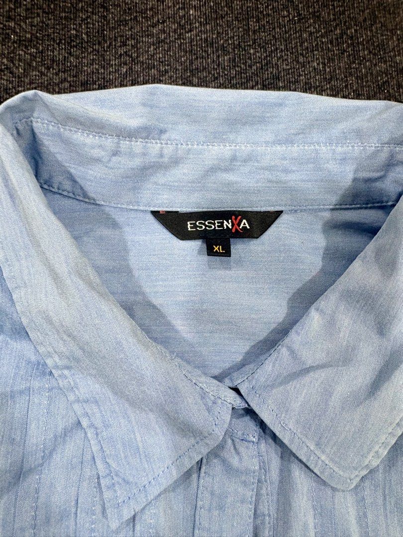 Essenxa A Light Blue Long Sleeve Button Up Blouse Size XL (Category: Longsleeves) located in Quezon City. Submitted by fast.closetfinds (Listing ID 1469021143, Image 3). Description: - Brand/Model: Essenx A light blue long sleeve button-up shirt - Design: Classic point collar, front button placket, and stylish pleated panel detailing on the chest - Details: Buttoned cuffs and a standard hem length with a clean finish - Versatility: A great wardro