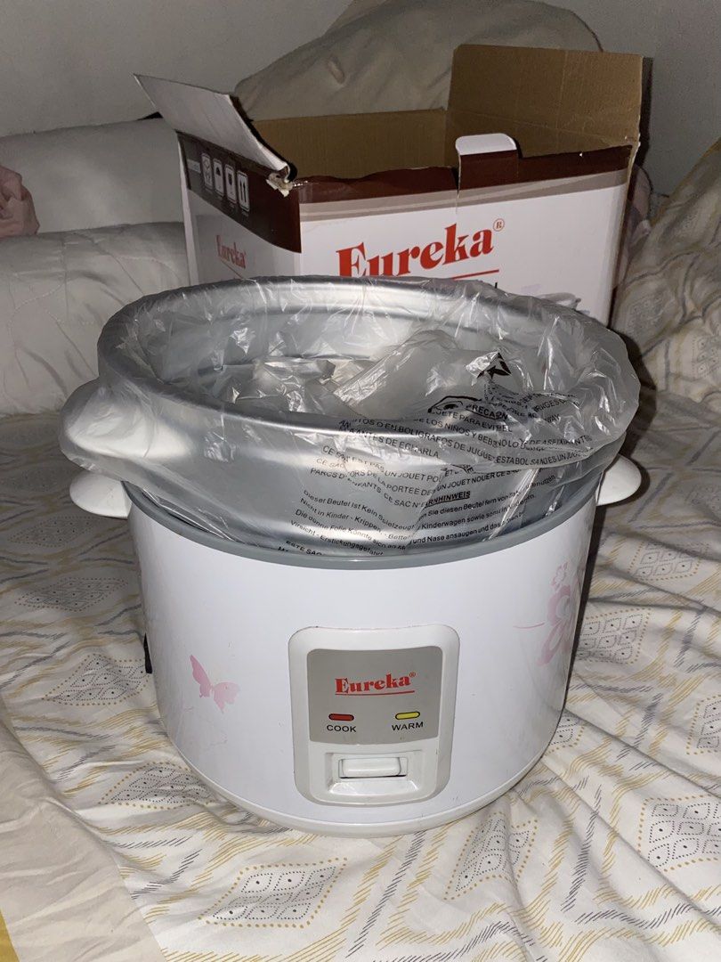 Eureka ERC 1.8LJ Rice Cooker with Steamer (Category: Cookers) located in Manila. Submitted by ssarskie (Listing ID 1469036715, Image 1). Description: - Brand new, never used Eureka rice cooker (1.8L capacity) - Charming white body with pink floral and butterfly print - Easy one-touch operation with automatic warm function - Includes original box, inner pot, and steamer attachment (all in original plastic wrappers) - Perfect for daily cooking and 