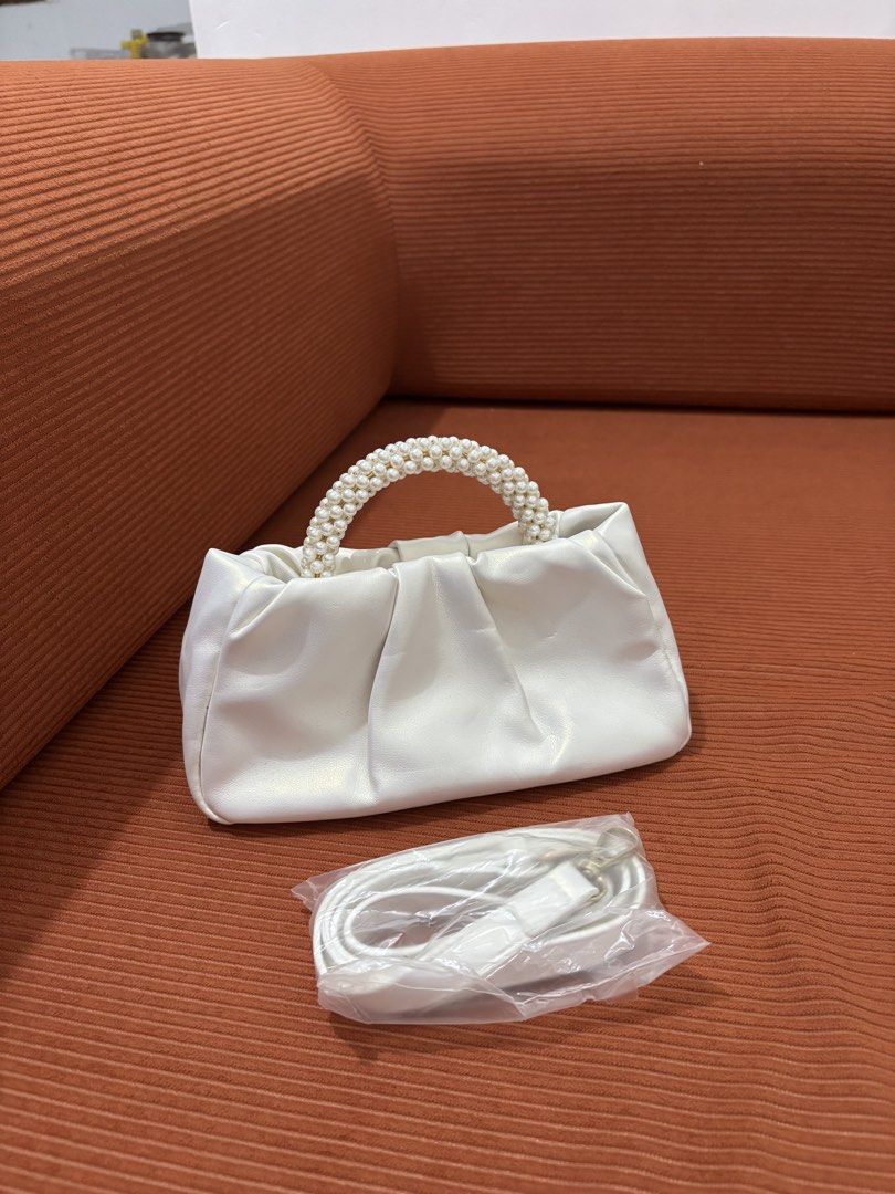 Evening bag with faux pearl handle (Category: Shoulder Bags) located in General Trias. Submitted by shinzn (Listing ID 1469094260, Image 1). Description: Evening bag with faux pearl handle bought it sa shein no scratches used twice lang with small dents (natupi kasi nakalagay sa maleta) location: gentri cavite rfs: decluttering .
