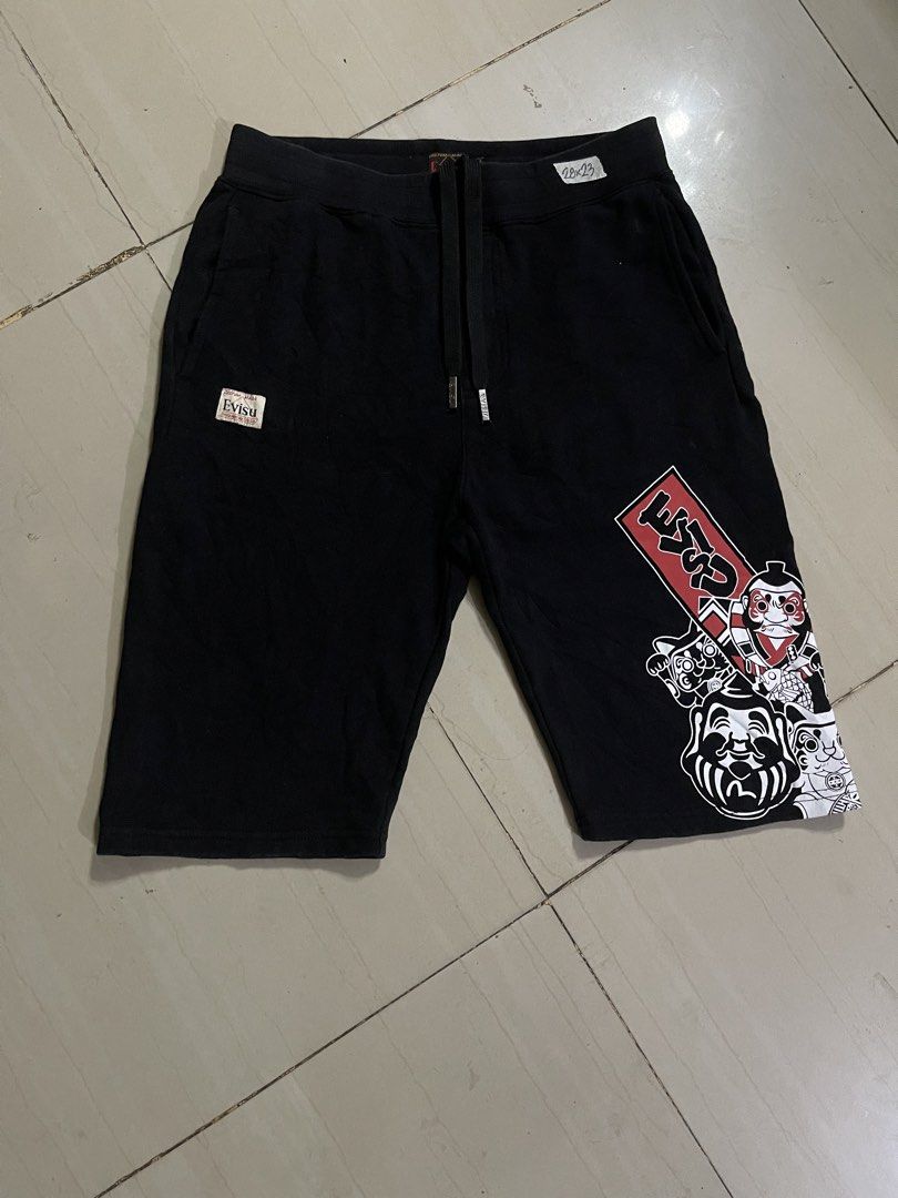 Evisu Heritage Custom Made Black Graphic Shorts Size M (Category: Shorts) located in Manila. Submitted by stuzzygod (Listing ID 1469084779, Image 1). Description: - Brand: Evisu Heritage (Custom Made) - Size 28 - Length 23 - Color: Black - Size: M (fits waist 28 to 33) - Material: Soft fleece cotton - Features: Drawstring waistband, front pockets, single back pocket - Details: Graphic prints on left leg and Japanese typography - Condition: Very c