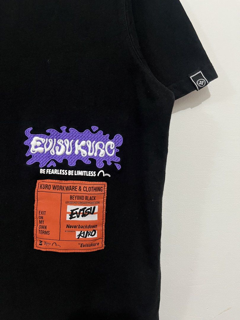 Evisu Liquidfied Logo Label T-Shirt (Category: Tshirts & Polo Shirts ) located in Daet. Submitted by rens.finds (Listing ID 1469113164, Image 2). Description: - Brand: Evisu - Condition: 9/10 - Issue: ❌ - Color Rate: 9.5/10 - Length x Width ( 26.5x 22 ) “Actual product color may vary due to lighting.” ⬅️ Swipe For More Details .