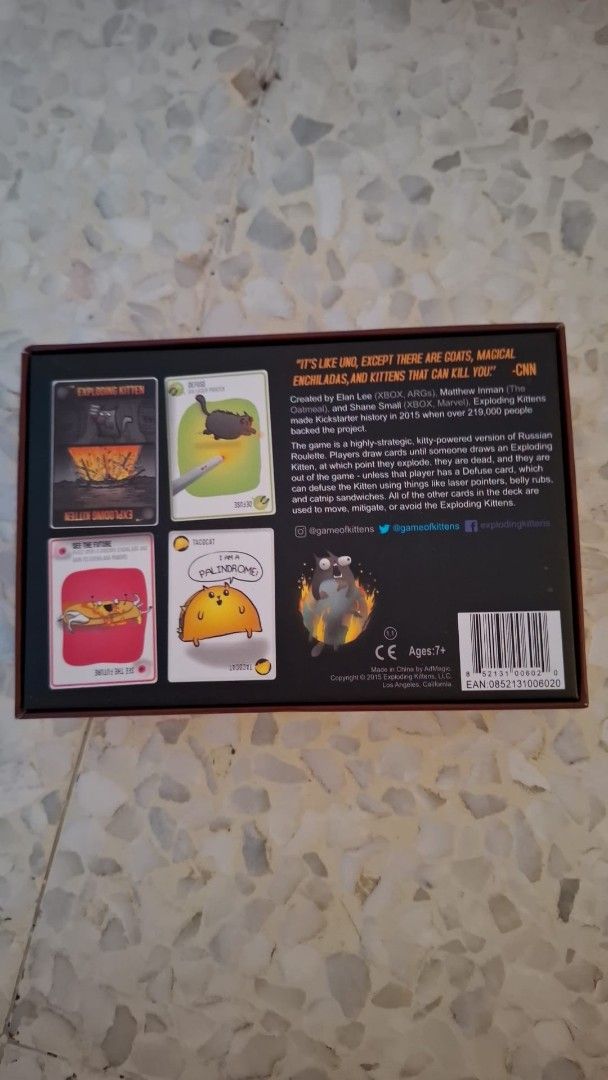 Exploding Kittens Card Game (Category: Board Games & Puzzles) located in Singapore. Submitted by gamerlyfe (Listing ID 1468982664, Image 2). Description: brand new exploding kitten game! received as gift. - Game: Exploding Kittens Party Card Game - Gameplay: Russian roulette style, quick 15-minute rounds - Players: 2 to 5 players - Age: 7 years and up - Features: Cats, laser beams, goats, and iconic angry cat box artwork - Condition: Brand new / 