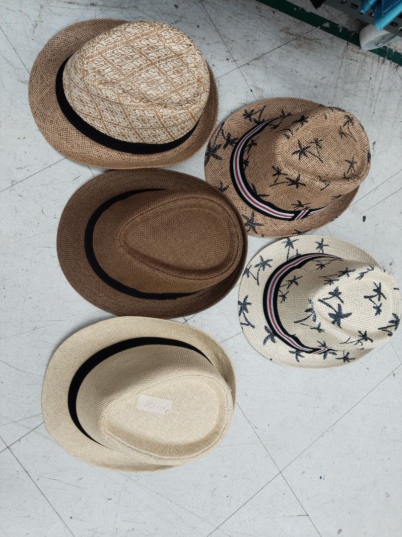 Fedora Hat (Category: Caps & Hats) located in Manila. Submitted by zdmal (Listing ID 1468963446, Image 1). Description: - Bundle of straw fedoras in tan, cream, and brown shades - Includes designs with patterned bands and palm tree prints - Classic resort style, ideal for sunny days and travels - Easy to match with various casual outfits - Selling as a set.