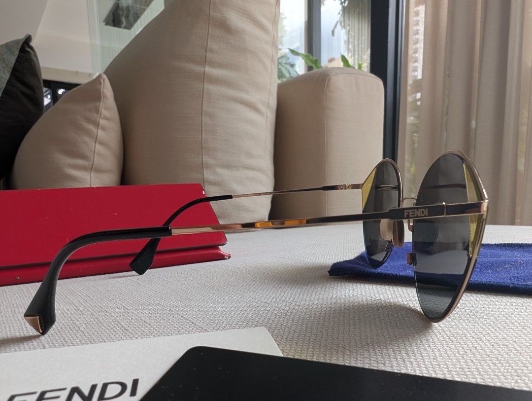 Fendi FF Gold Metal Cateye (Category: Sunglasses & Eyewear) located in Pasig City. Submitted by ejereyes (Listing ID 1468974885, Image 2). Description: Fendi FF 0341/S Gold Metal Cateye Guaranteed authentic Complete set with red Fendi leather triangular case, authentication card, envelope, and blue Paris Miki cleaning cloth Honest issue: Case material has some peeling. But this doesn't affect the condition of the sunglasses. RFS: Downsizing perso