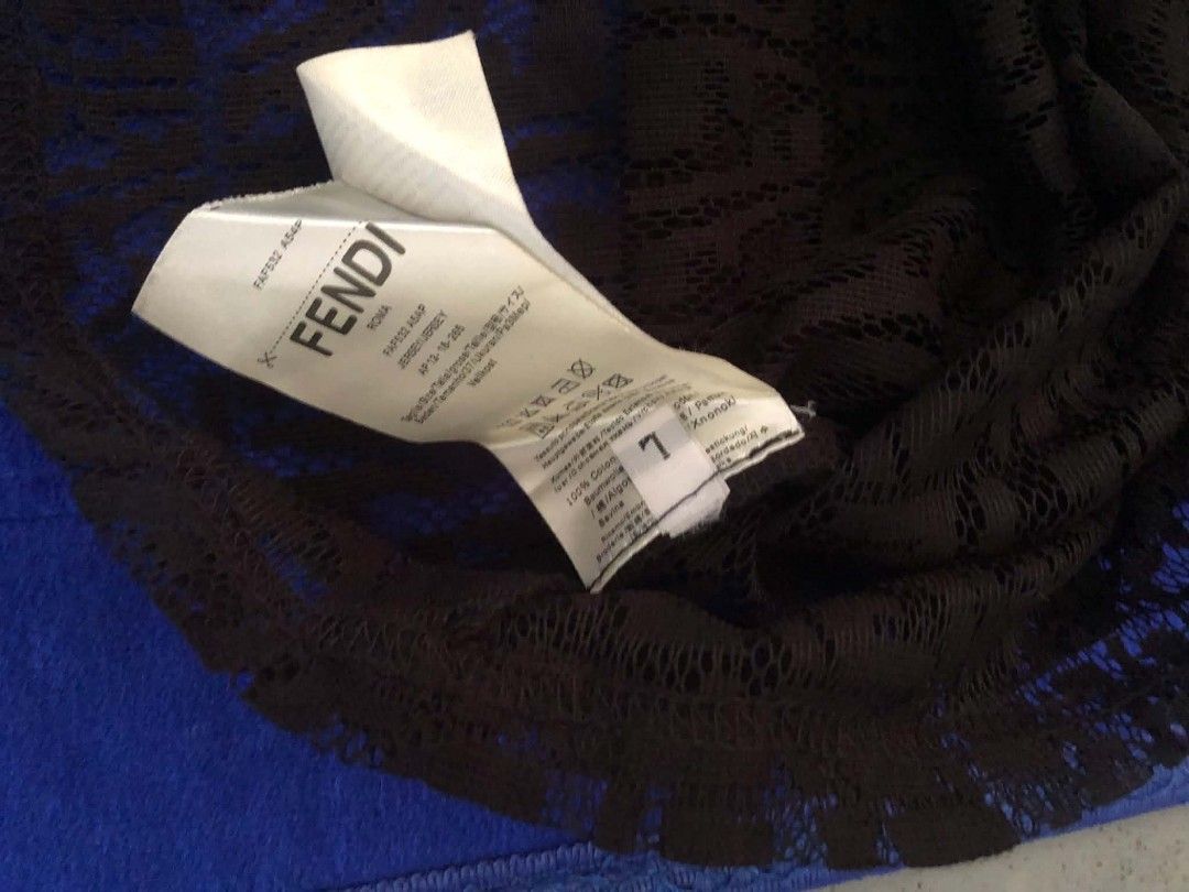 Fendi FF Monogram Lace Black T-Shirt (Category: Shirts) located in Manila. Submitted by wonderboi80 (Listing ID 1468981188, Image 2). Description: Fendi black t-shirt made from lace fabric. All-over FF monogram pattern throughout the body and sleeves. Classic crew neck design. Interior brand label stitched near the collar. Care label shows size information and material composition clearly. Made in Italy construction..