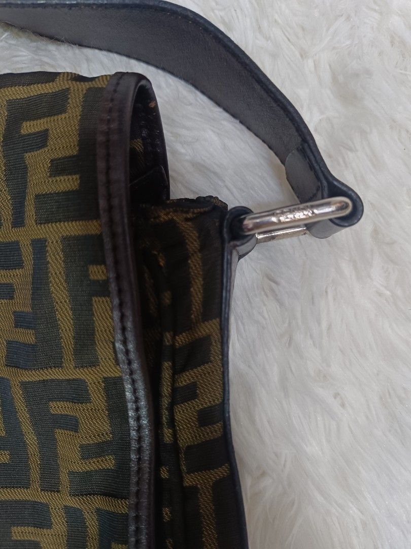 Fendi Zucca Print Messenger Bag (Category: Luxury Bags & Wallets) located in Pateros City. Submitted by harry062182 (Listing ID 1469086527, Image 2). Description: - Authentic Fendi Zucca canvas messenger bag in brown and black - Adjustable dark brown leather strap for a custom fit - Sleek silver-tone hardware and classic flap with magnetic snap closure - Made in Italy (interior tag intact) - Spacious interior with clean fabric, perfect for daily 