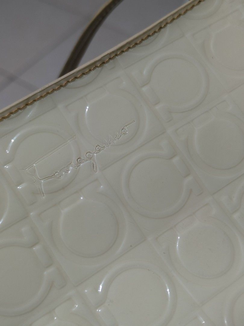 Ferragamo White Patent Leather Crescent Shoulder Bag (Category: Luxury Bags & Wallets) located in Manila. Submitted by bigtym.picker (Listing ID 1469013898, Image 3). Description: FOR SALE!!! PLS SEE PIC FOR DETAILS. Selling all items AS IS PLS. manage your Expectation We accept shipping nationwide Meetup - BACOOR or near MOA - Style: Crescent shoulder bag in glossy white patent leather - Design: All-over embossed monogram pattern with clean line