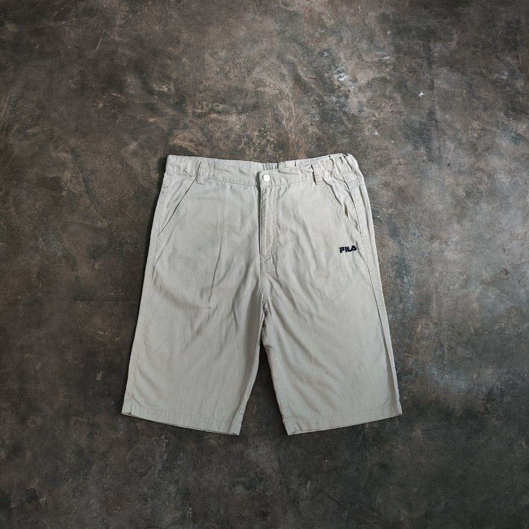 Fila Khaki Shorts (Category: Shorts) located in Rosales. Submitted by kudoscache (Listing ID 1469066414, Image 1). Description: - Brand: Fila - Waist: 28-30 | Length: 19 - Color: Khaki / Beige - slightly nego payment: maribank / gotyme courier: J&T.