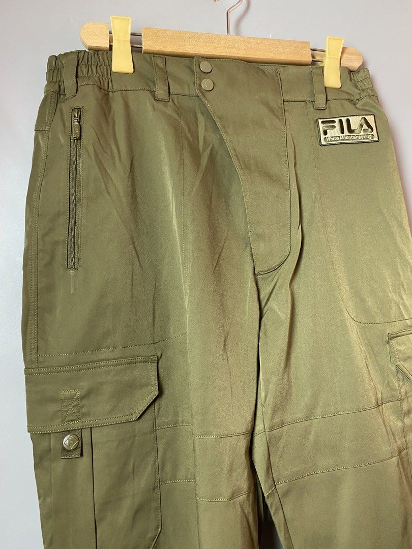Fila x White Mountaineering Cargo Pants (Category: Trousers) located in Quezon City. Submitted by loloyz123 (Listing ID 1469099485, Image 2). Description: Fila x White Mountaineering Cargo Pants Condition: Very good Color rate: 10/10 Color: olive green Size: Xlarge L: 39 W: 16 inches.