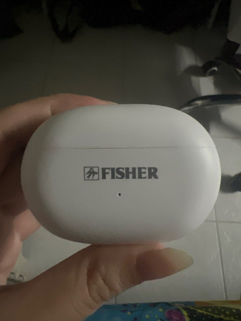 Fisher Wireless Earbuds Charging Case (Category: Earphones) located in Manila. Submitted by clevermoon.553710 (Listing ID 1469053161, Image 1). Description: - Authentic Fisher wireless earbuds charging case - Color: Clean white with front logo - Design: Smooth oval shape with small LED indicator - Condition: Excellent, pristine exterior with no scratches - Portability: Compact size, pocket and bag friendly.
