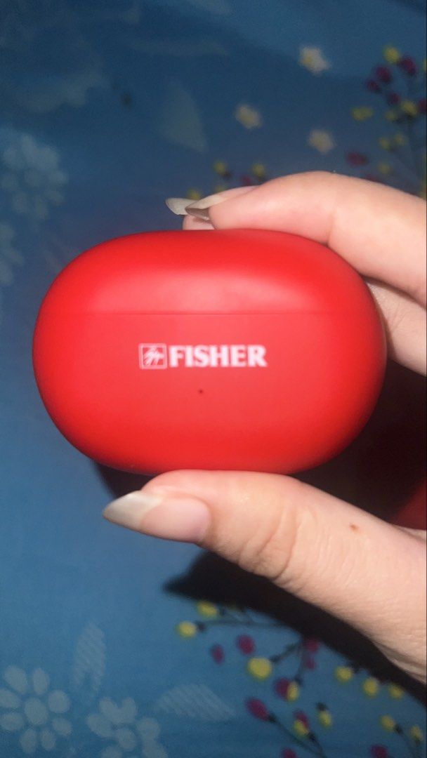 Fisher Wireless Earbuds Red RUSH !! (Category: Earphones) located in Manila. Submitted by clevermoon.553710 (Listing ID 1469102847, Image 1). Description: - Brand: Fisher wireless earbuds charging case - Color/Finish: Vibrant red matte finish - Design: Compact pill shape that easily fits in pockets or bags - Feature: Small indicator light on the front panel -bought from new york - Condition: Clean surface with minimal handling marks - Inclusion: 