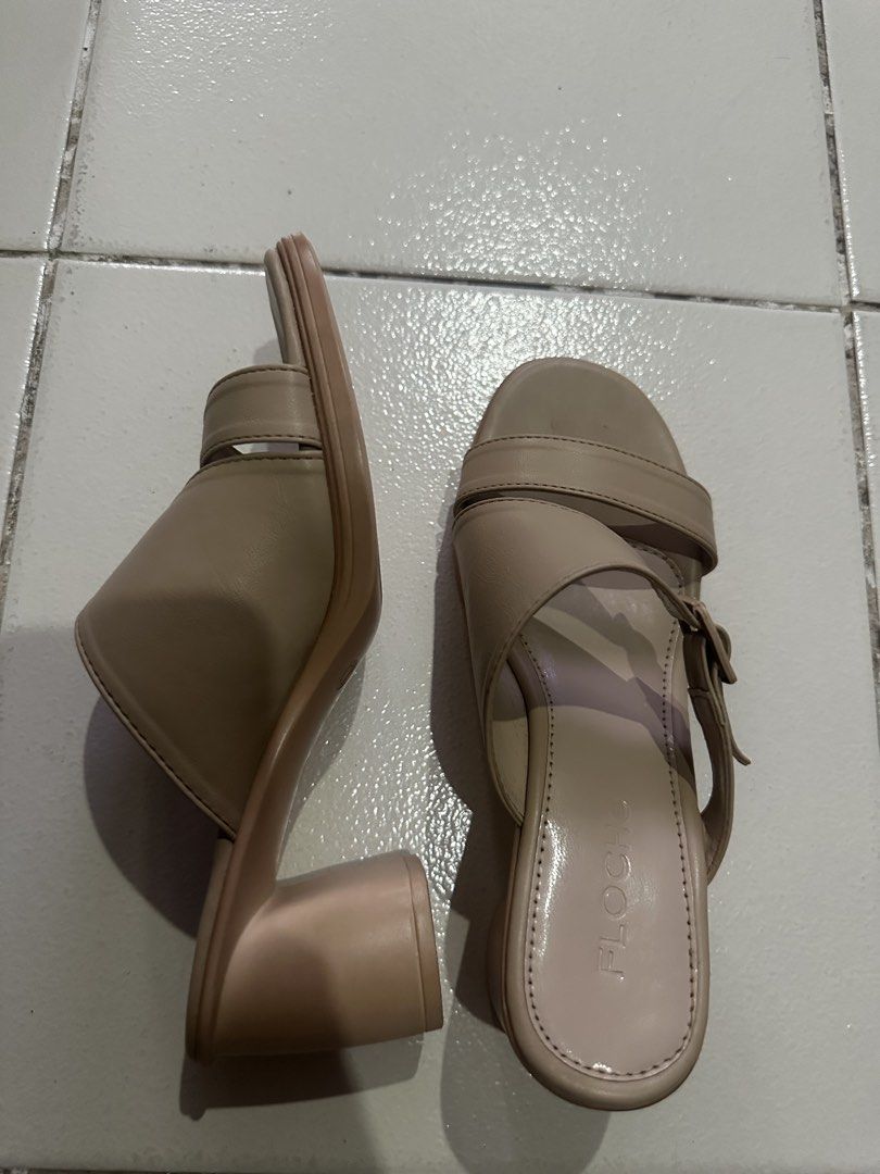 Floche Nude Beige Chunky Heel Sandals (Category: Heels) located in Vinzons. Submitted by melodylarg85741 (Listing ID 1469086797, Image 2). Description: - Brand: Floche - Color: Nude beige - Style: Open-toe block heel sandals with criss-cross straps and side buckle detail - Heel: Stable chunky mid-height heel for comfortable walking - Insole: Cushioned with Floche branding - Condition: [Insert Condition] - Meetups and shipping available!.