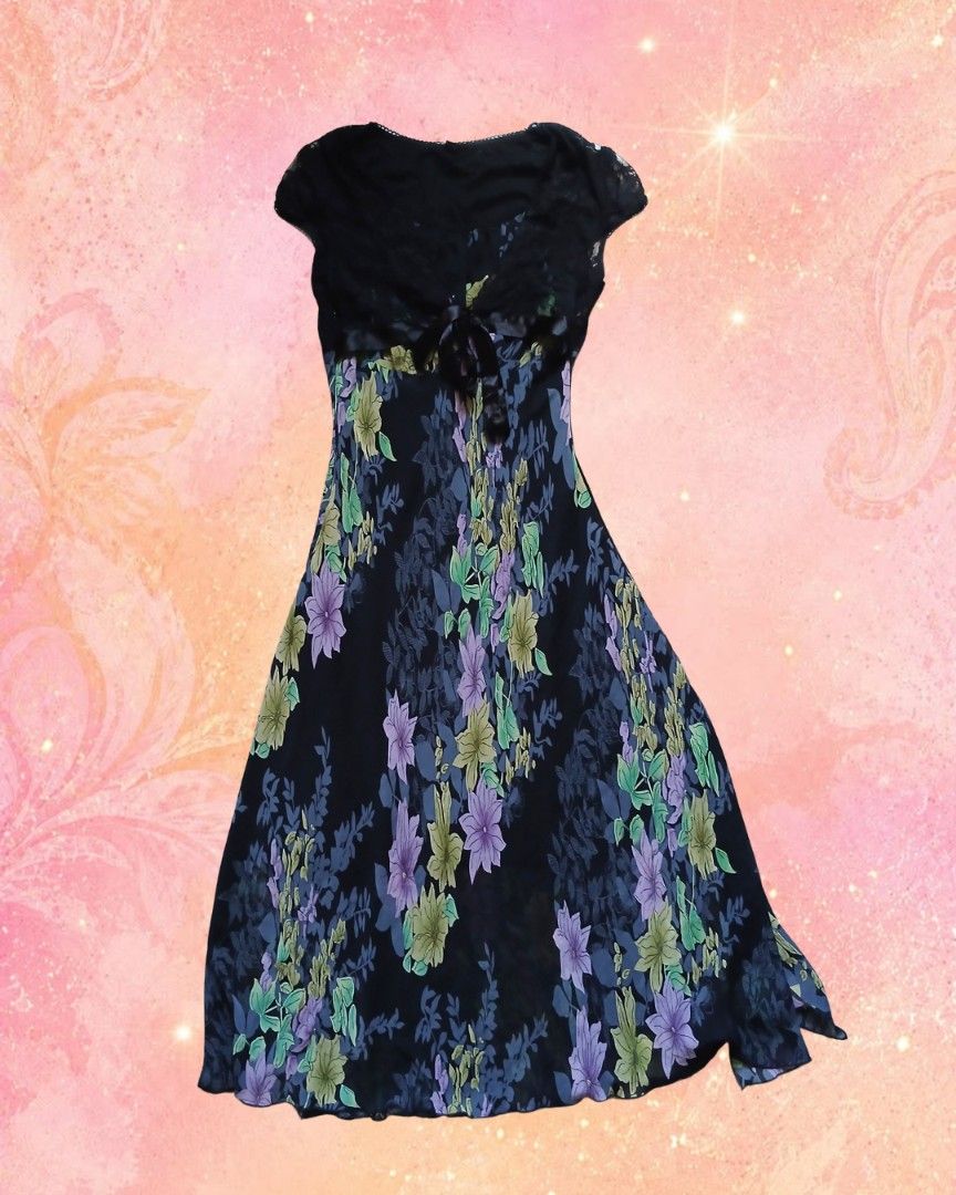 Floral pattern dress with black lace top (Category: Dresses) located in Antipolo. Submitted by mochisky (Listing ID 1468973147, Image 1). Description: - Set includes: Floral pattern skirt and black lace top - Size: XS to small - Neckline & Sleeves: Scooped neckline with short sleeves - Detail: Charming black ribbon tie at the center chest - Material: Flowy and falls nicely for a great fit.