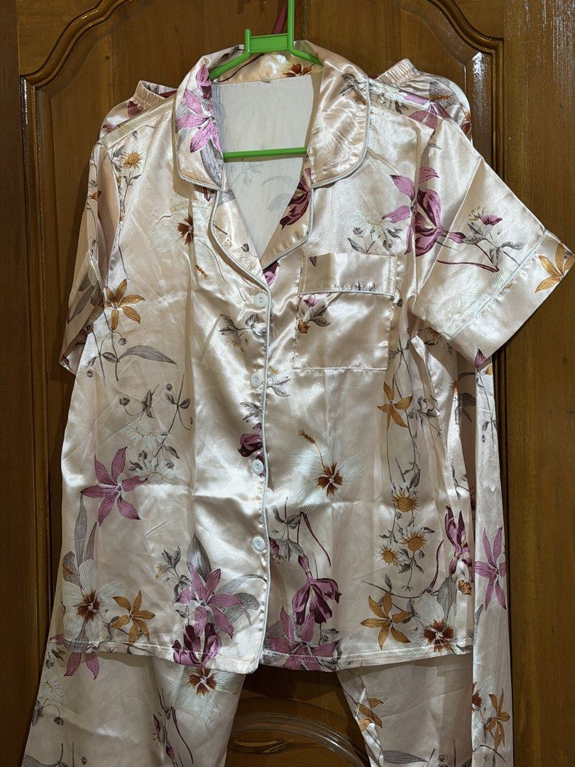 Floral Print Pajama Set (Category: Undergarments & Loungewear) located in Caloocan City. Submitted by sisi_p (Listing ID 1469004679, Image 3). Description: - Pink satin pajama set with a cute all-over floral pattern - Short-sleeve button-down top featuring a convenient chest pocket - Matching pants designed with an elastic waistband for maximum comfort - Lightweight and smooth material, ideal for lounging or sleeping.