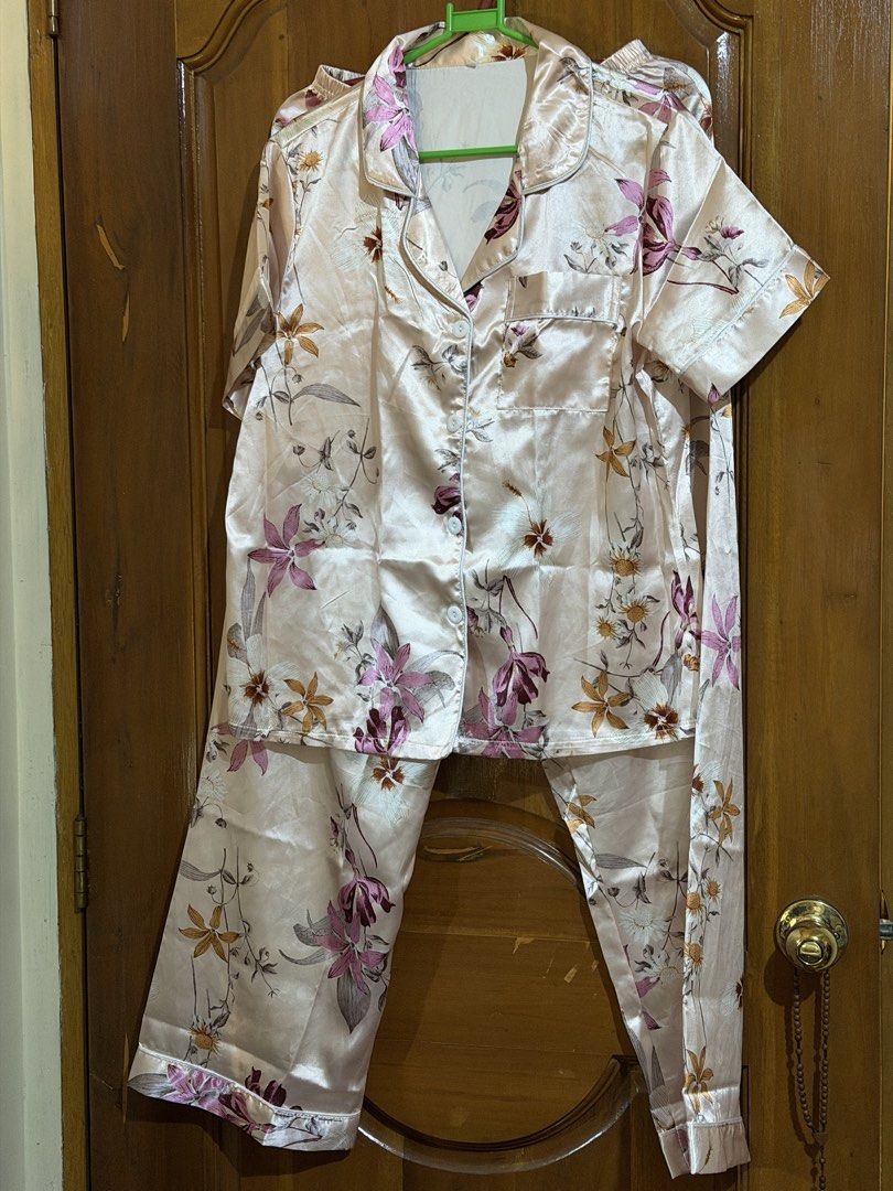 Floral Print Pajama Set (Category: Undergarments & Loungewear) located in Caloocan City. Submitted by sisi_p (Listing ID 1469004679, Image 1). Description: - Pink satin pajama set with a cute all-over floral pattern - Short-sleeve button-down top featuring a convenient chest pocket - Matching pants designed with an elastic waistband for maximum comfort - Lightweight and smooth material, ideal for lounging or sleeping.