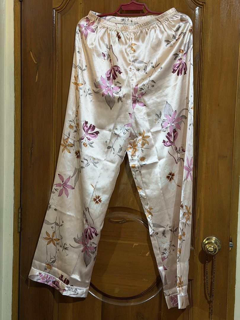Floral Print Pajama Set (Category: Undergarments & Loungewear) located in Caloocan City. Submitted by sisi_p (Listing ID 1469004679, Image 2). Description: - Pink satin pajama set with a cute all-over floral pattern - Short-sleeve button-down top featuring a convenient chest pocket - Matching pants designed with an elastic waistband for maximum comfort - Lightweight and smooth material, ideal for lounging or sleeping.