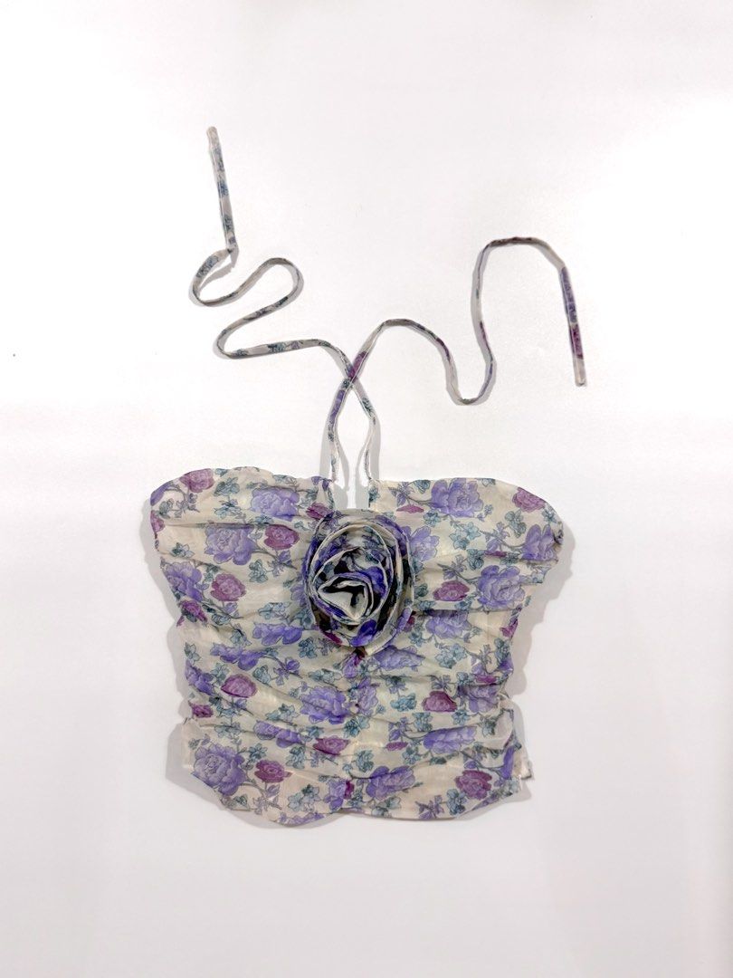 Floral Print Ruched Halter Top With 3D Rose (Category: Sleeveless) located in Baguio. Submitted by kimkim2424 (Listing ID 1469065385, Image 1). Description: - Purple and blue floral print on lightweight white mesh fabric - Halter neck style with adjustable long ties - Flattering ruched body featuring a cute 3D fabric rose at the center - Trendy cropped length with a delicate scalloped bottom hem - Perfect for warm weather; easy to match with high