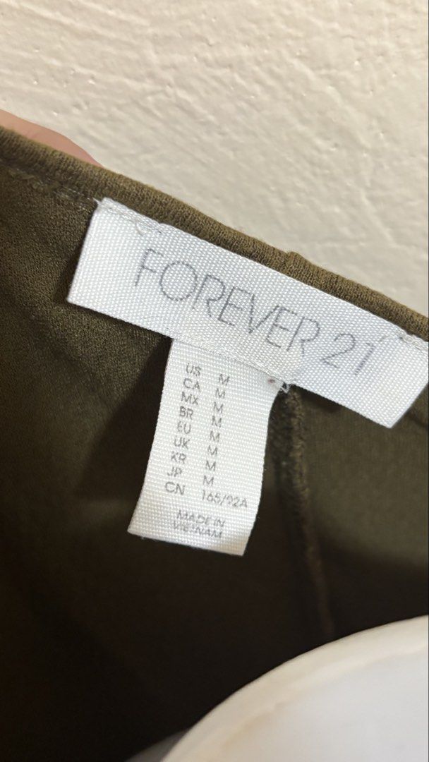 Forever 21 Olive Green Bodycon Dress Medium (Category: Dresses) located in Santa Cruz. Submitted by homedecluttersale (Listing ID 1469142010, Image 2). Description: • Bought in Forever 21 Japan 🇯🇵 • Used / Excellent condition • Fits small to Large • Photos taken using mannequin only 🚚 Shipping via J&T only 📦 Shipping fee to be shouldered by buyer 💳 Mode of payment: GCash 📍 Santa Cruz, Laguna.
