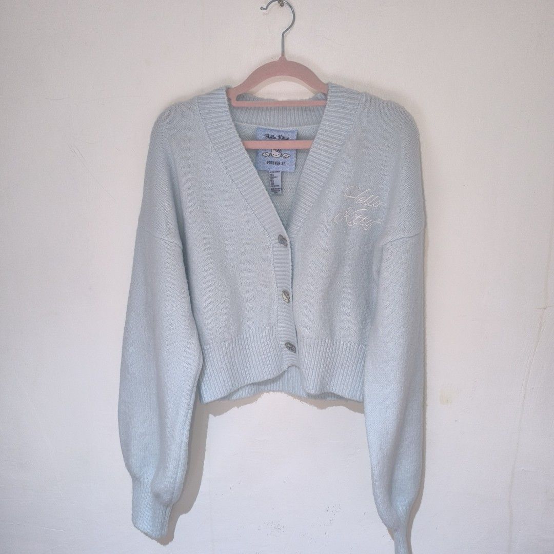 Forever 21 x Sanrio Light Blue Cardigan (Category: Coats, Jackets and Outerwear) located in Manila. Submitted by yui021 (Listing ID 1469123714, Image 2). Description: - Light blue fuzzy knit V-neck cardigan from the Sanrio × Forever 21 "Blue Angel" collection. - MOP: Maribank - LOC: Sta. Ana, Manila.