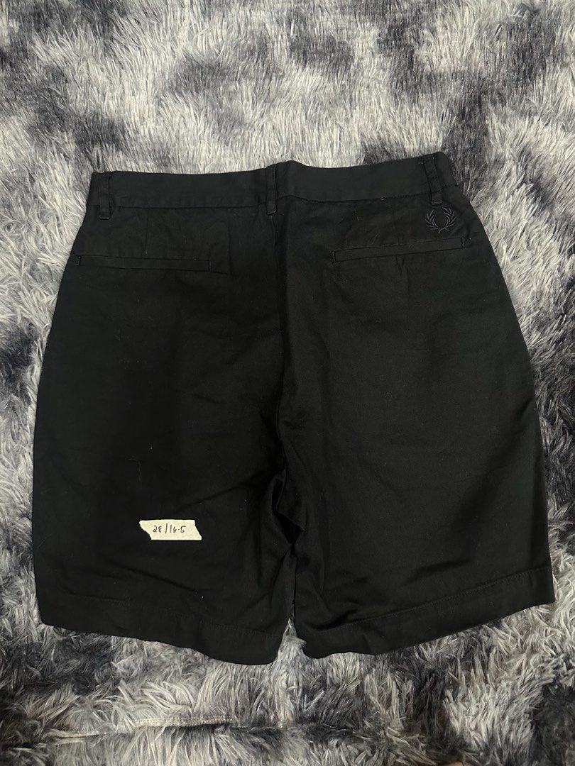 Fred Perry Black Shorts (Category: Shorts) located in Quezon City. Submitted by nichole12 (Listing ID 1469090522, Image 1). Description: - Brand: Fred Perry - Color: Solid black - Size: Tagged size 28 (16.5-inch measurement) - Details: Classic embroidered laurel wreath logo above the right back pocket - Pockets: Back welt pockets with button closure - Features: Structured waistband with belt loops and clean stitching - Condition: Great everyday w