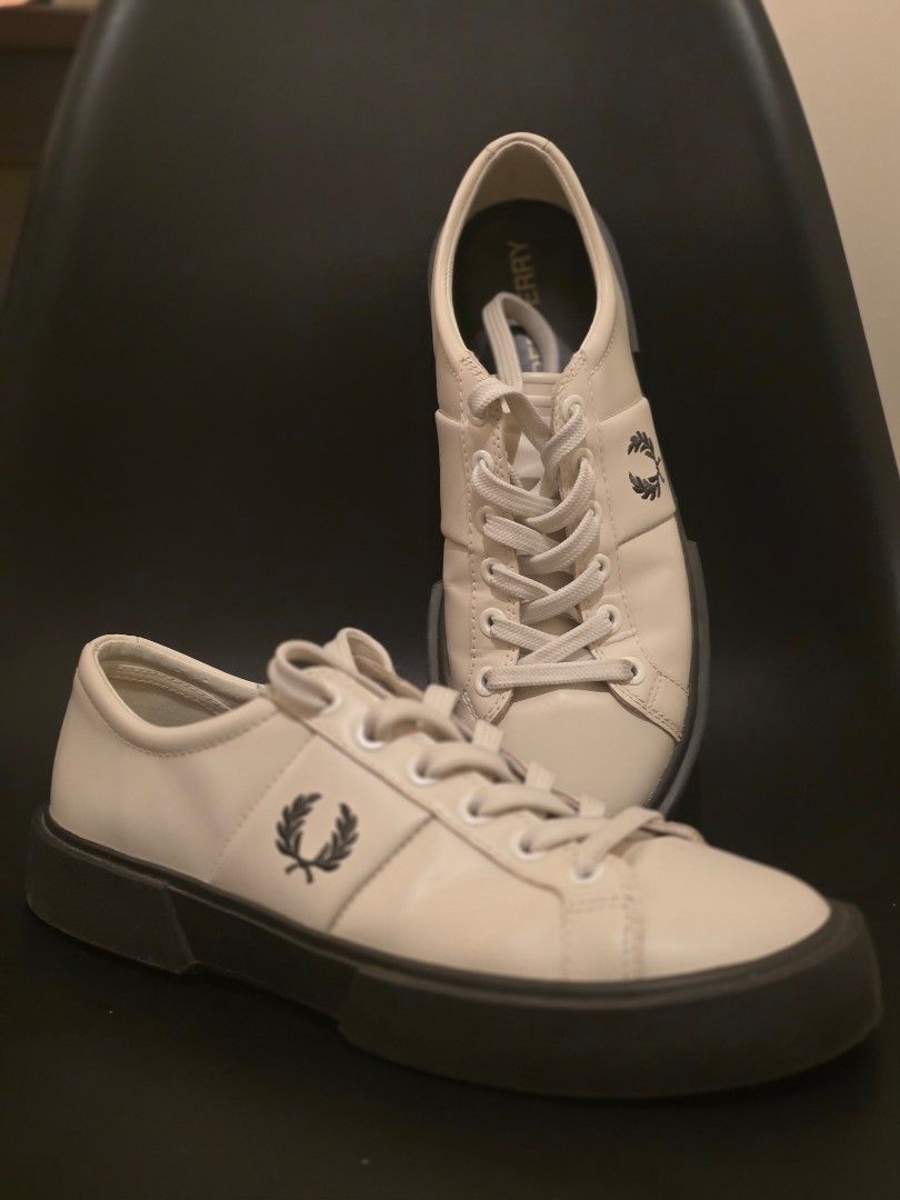 Fred Perry white leather chunky platform sneakers (Category: Sneakers) located in Makati City. Submitted by coolbeansyeah (Listing ID 1469096144, Image 2). Description: - Brand: Fred Perry - Color: White leather with dark thick soles - Features: Iconic laurel wreath logo on side and heel, gold insole branding - Condition: Excellent, clean treads with minimal wear. only worn twice. - Style: Classic tennis shoe with a modern platform twist - Locati