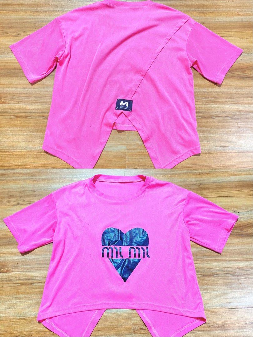 FREE‼️If u purchase anything 🥰 (Category: Shirts) located in Bulacan. Submitted by Spothings (Listing ID 1469160714, Image 1). Description: Free only‼️when u purchase anything 🥰 - Color: Bright pink - Design: Blue metallic heart print with center branding - Back detail: Unique overlapping split back with a small logo label near the hem - Fit: Relaxed, super casual vibe - Styling: Perfect to pair with high-waisted jeans or shorts - Condition: Ex