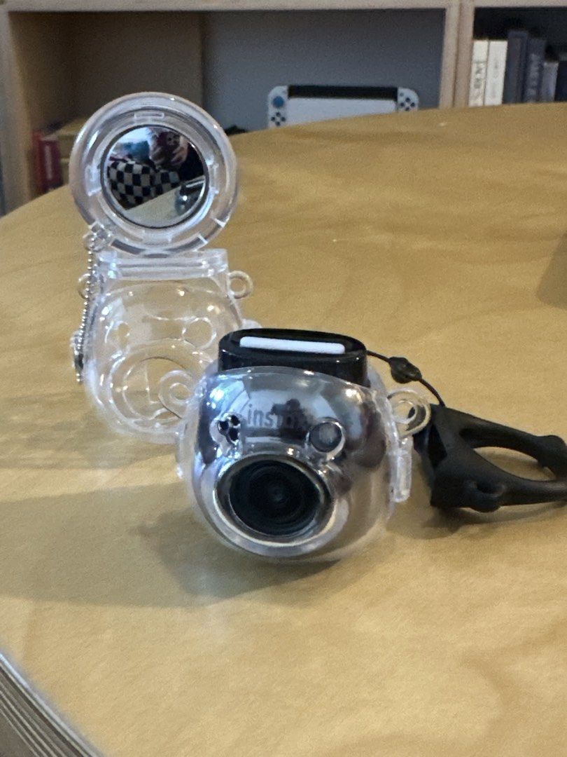 Fujifilm Instax Pal Digital Camera Gem Black (Category: Cameras) located in Pasig City. Submitted by cosmicjuice08 (Listing ID 1468947917, Image 3). Description: - Model: Fujifilm Instax Pal Digital Camera - Color: Gem Black finish - Design: Ultra-compact pocket size with wide-angle lens and top shutter button - Extras included: Clear protective silicone case and detachable strap - Connectivity: USB-C charging port - Condition: Fully functional a