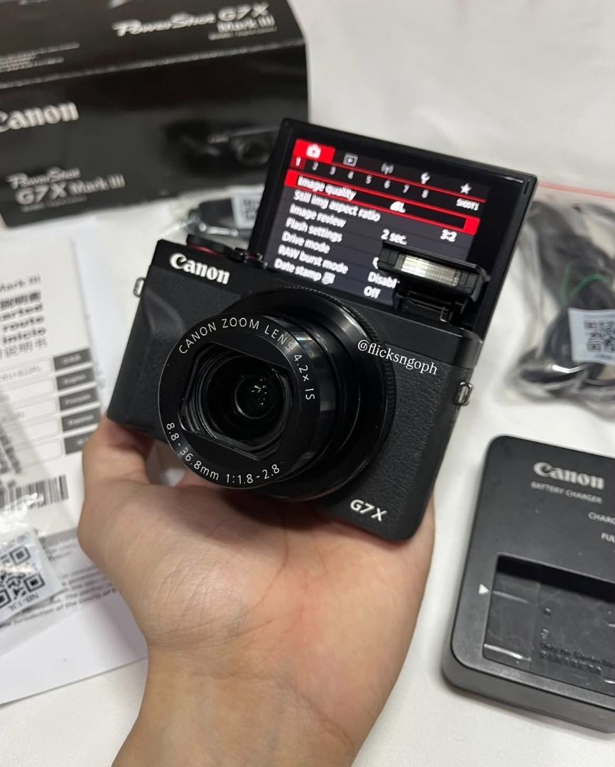 G7x Mark III (Category: Cameras) located in Caloocan City. Submitted by boldfalcon.712f00 (Listing ID 1469110835, Image 2). Description: - Brand/Model: Canon PowerShot G7X Mark III - Color: Black - Condition: Excellent, complete with box and accessories - Included Accessories: Battery, battery charger, power cable, and 32GB Lexar SD card - Features: Compact body, flip-up screen, ideal for vlogging and daily content creation.