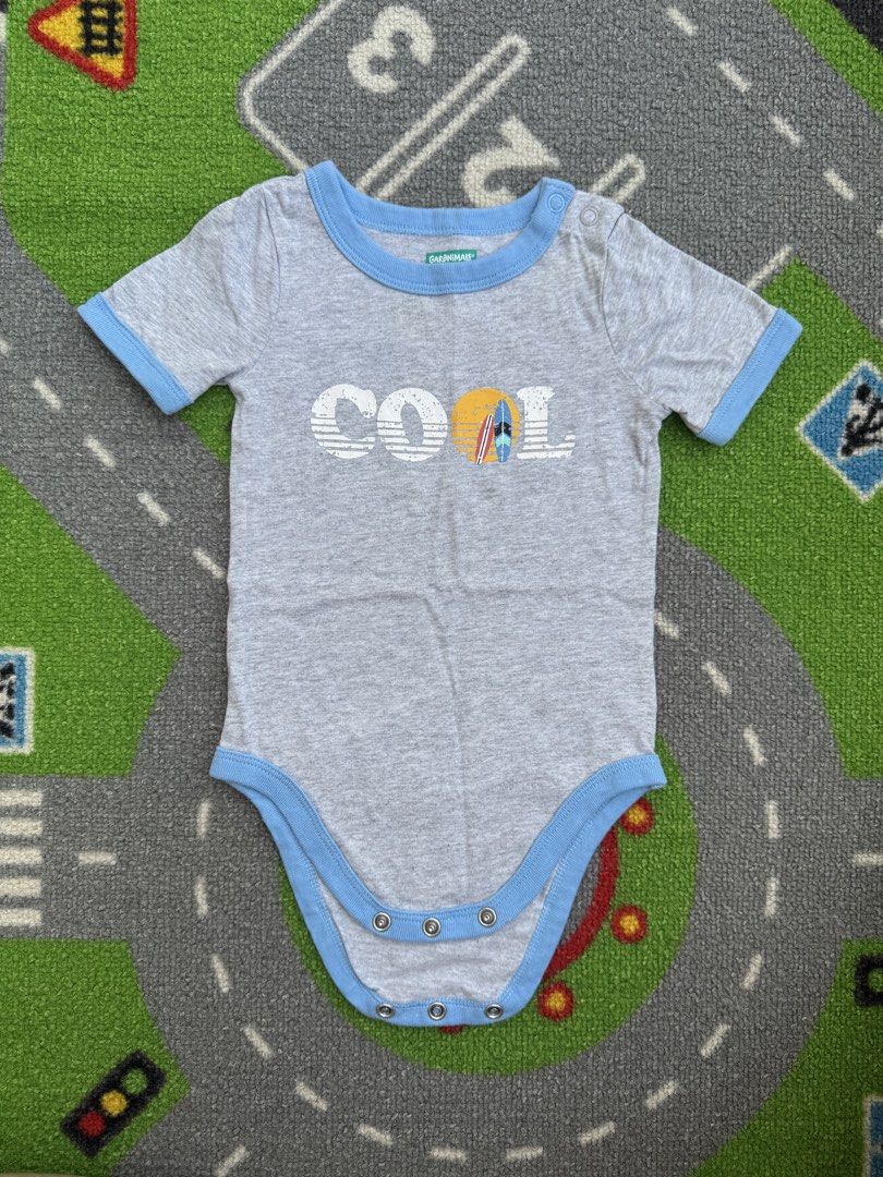 Garanimals Bodysuit Onesie (Category: Babies & Kids Fashion) located in Rizal. Submitted by preloovved (Listing ID 1469060380, Image 1). Description: Super cute and comfy gray baby bodysuit featuring a fun 'COOL' surf graphic. Made of soft, breathable cotton with light blue trim and snap buttons for easy dressing. Perfect for warm weather! Preloved, 12mos Meet-up only in GB1 San Mateo, Rizal Shipping fee c/o buyer. Tres Marias or J&T express Paym
